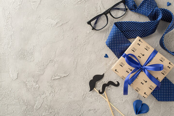 Give Dad the perfect Father's Day salute: top view of elegant necktie, giftbox, glasses, mustaches...