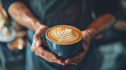 Creating a cappuccino: The artistic touch of a barista on a blurry background