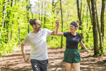 Couple jogging and running outdoors in nature