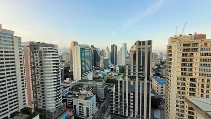 sunset hours in bangkok with skyscrapers