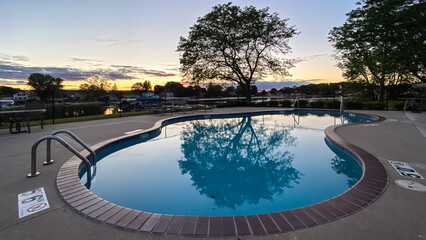 Outdoor Pool with Reflections at Sunset