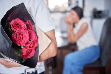 Hope, couple and man with flowers as surprise, anniversary celebration and romance in marriage....