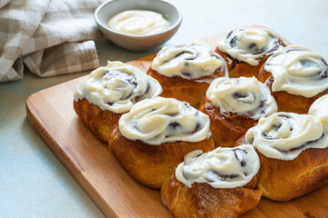 Cinnamon buns, homemade traditional sweet rolls with cream cheese icing