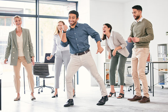 Team, dance and office celebration with businesspeople for victory, goal and accomplishment together. Corporate, win, success and stress relief after good news about startup, company and enjoyment