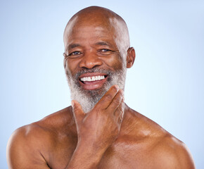 Portrait, beard care and senior black man for grooming isolated on blue background with confidence....