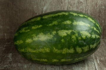 whole watermelon on wooden background