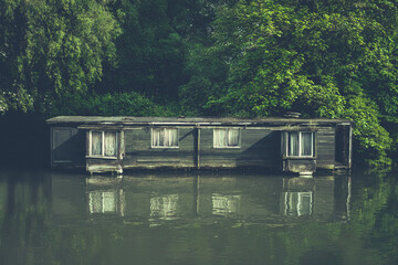 Rundown Houseboat On A River