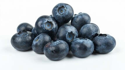 Heap of fresh dark blue blueberries isolated on a white background highlighting their natural texture