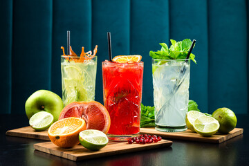 Summer healthy cocktails, set of various citrus lemonades or mojitos, with lime lemon orange grapefruit, diet detox beverages