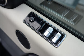 Car Window and Side Mirror Control Switches Close-Up