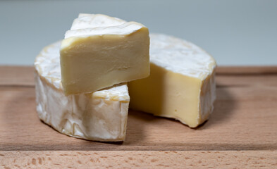 fresh brie cheese on a wooden background. High quality photo