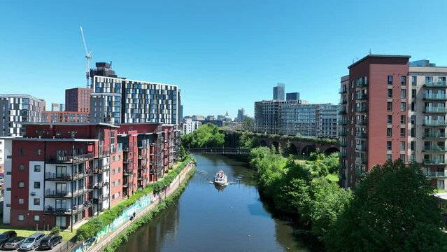 Travelling up the River Irwell in the city of Manchester in Northwest England