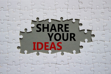 Share your Ideas symbol. Concept words Share your Ideas on white puzzle. Beautiful grey background. Business and Share your Ideas concept. Copy space.