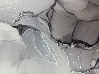 Abstract grey marble with silver — fluid art background with potal, stone texture made with alcohol ink. Big black and white natural marble backdrop resembles silver watercolor or aquarelle.

