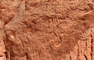 Prehistoric petroglyphs, rock art at Tadrart Rouge, Tadrart Akkak, Sahara, Algeria, horizontal view