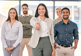 Obraz premium Smile, thumbs up and portrait of business people for collaboration in office for team building. Happy, approval and group of professional creative designers with support hand gesture in workplace