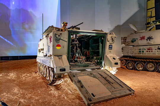 Royal Tank Museum, Amman, Jordan - May 4, 2024: American M113 APC from the 1960s Vietnam war era on display at the Royal Tank Museum in Jordan, illuminated by exhibition lights