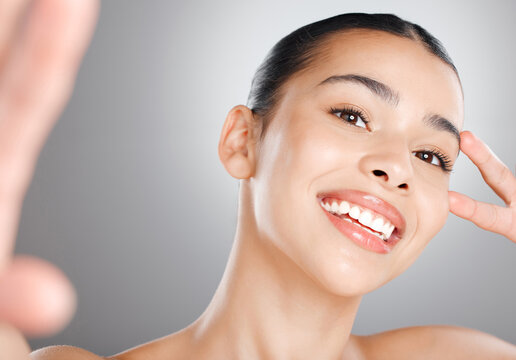 Selfie, beauty portrait or woman in studio with smile for social media, cosmetics review or profile picture. Girl model, peace sign or face photography for skincare or dermatology on white background