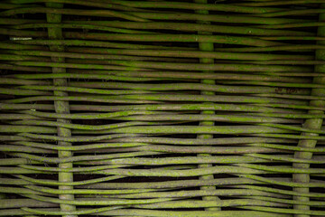 ancient house wall made of twigs of tree branches
