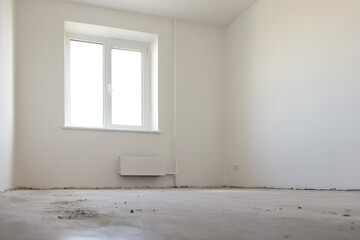 An empty room in an apartment with white walls. The concept of repair and interior.