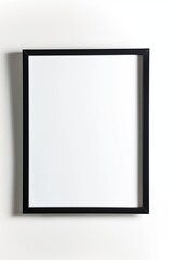 A black framed white picture with no picture inside