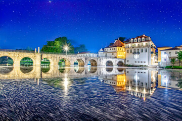 Ponte de Trajano reflected on Tamega river in Chaves, Portugal..