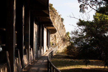 A gallery transitioning into a tunnel. Passage in the mountain above the Adriatic Sea. Sunny day. For the banner. Horizontal.