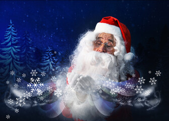 Santa Claus blowing snow in winter forest. Christmas magic