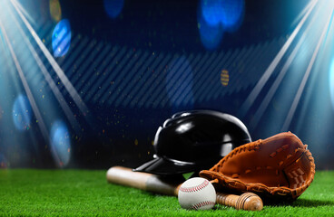 Baseball bat, glove, helmet and ball on grass at stadium. Space for text
