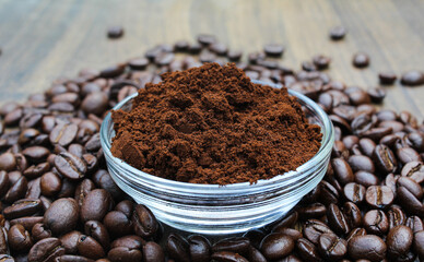 Roasted Coffee beans powder in a glass bowl 