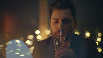 Rich man tasting champagne romantic date dark room closeup. Guy drinking alcohol