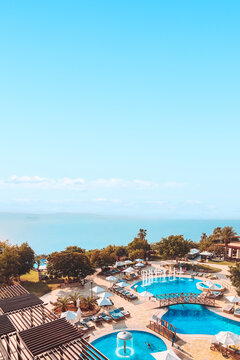 Dead Sea on the border of Jordan and Israel - View of the sea from the luxury resort pools. Copy space.