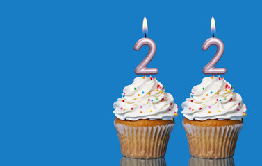 Birthday Cupcakes With Candles Lit Forming The Number 22