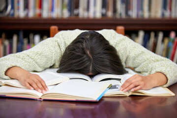 Student, sleeping and library with woman, exam and course research burnout from project at school. University, nap and notes with learning, education and studying with deadline and fatigue on campus