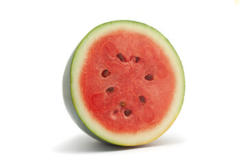 Close-up of a half watermelon (Citrullus Lanatus) fruit. Isolated on a white background.