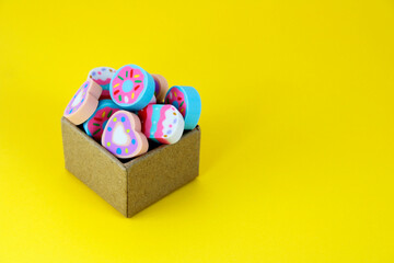 Erasers, box containing colorful candies