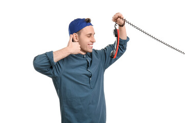 Cool young man with phone receiver showing 