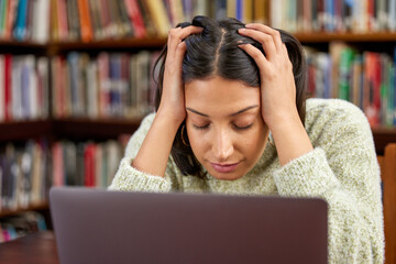 Library, university and woman on laptop with stress for research, studying and learning. Education, burnout and exhausted student with computer for knowledge, information and project at college