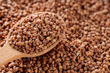 Scattered Dry Buckwheat with Wooden Spoon, Copy Space