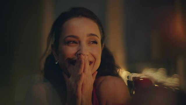 Excited woman reacting engagement ring at romantic atmosphere house closeup