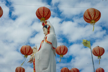 buddhist statue with lanterns sky view