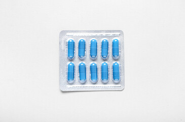 Blister pack with pills on white background