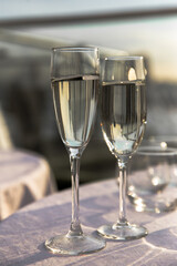 glasses of champagne in the sunlight, a romantic evening