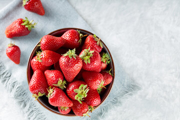 Fresh Ripe Strawberries in Bowl on Gray Napkin, Copy Space