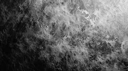 Fototapeta premium A black and white photo of a wall with a greyish texture