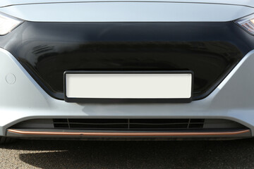 Obraz na płótnie Canvas Car with vehicle registration plate outdoors, closeup