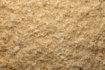 Dry natural sawdust as background, top view