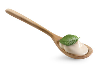 Spoon with delicious yogurt and basil isolated on white