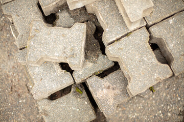 Paving stones lie on a pallet. Construction site, top shot, nobody. 
