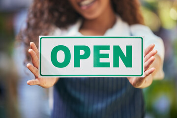 Woman hands, open sign and small business for cafe with welcome, advertising and startup for...